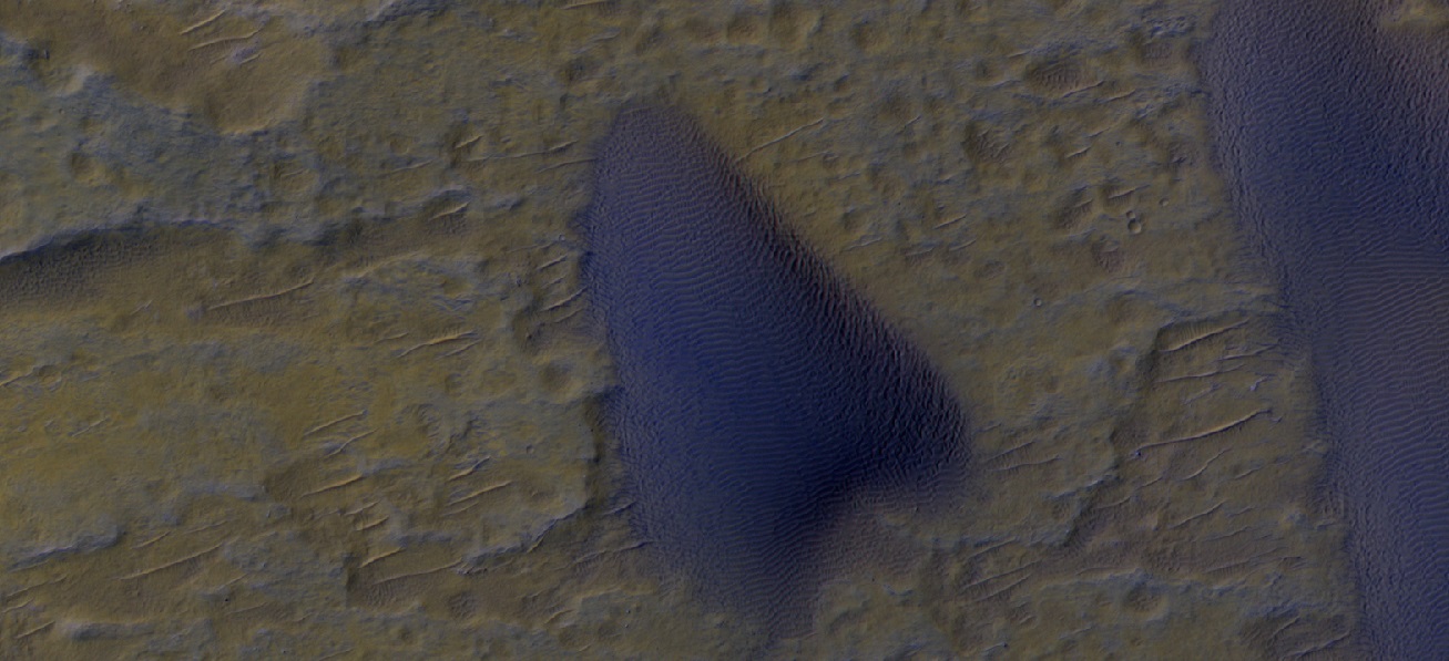 Close, color view of dunes Ripples are visible on dune surface.