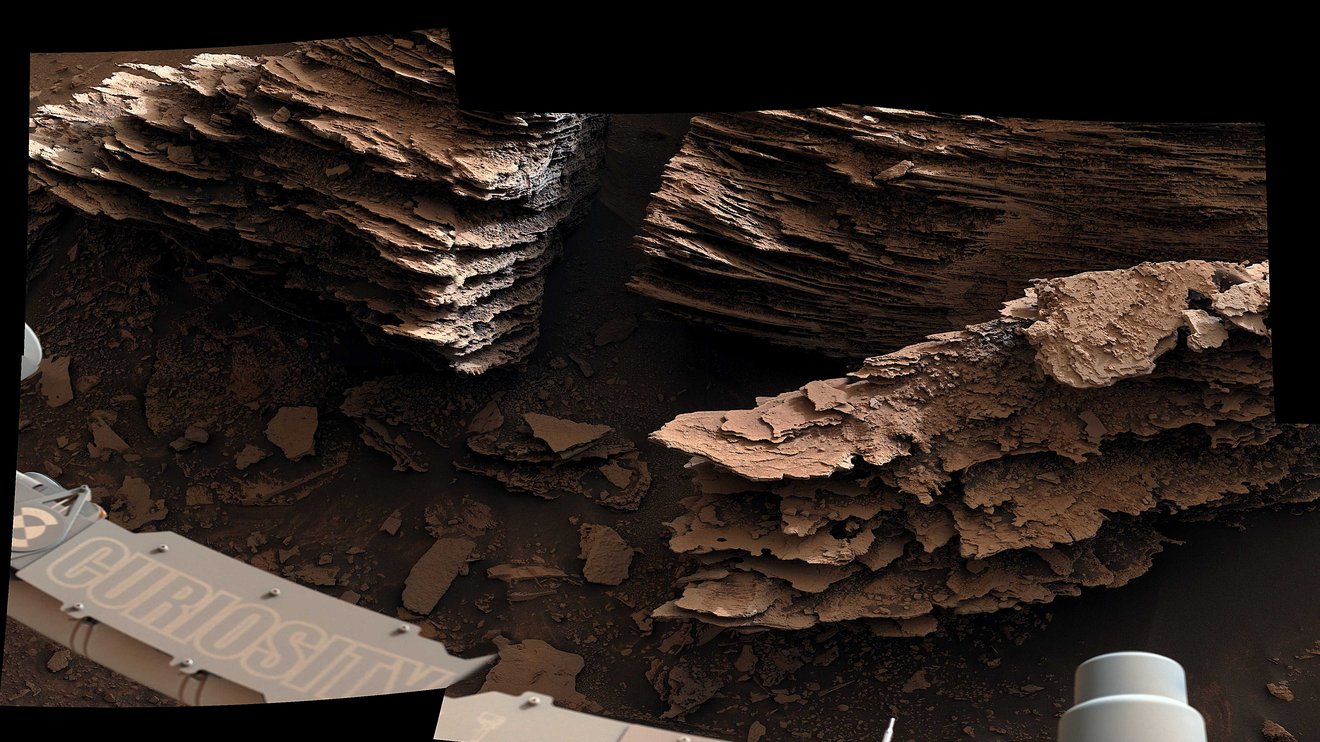 Thin layers, as seen by Curiosity. They may have formed in a pond or a stream.