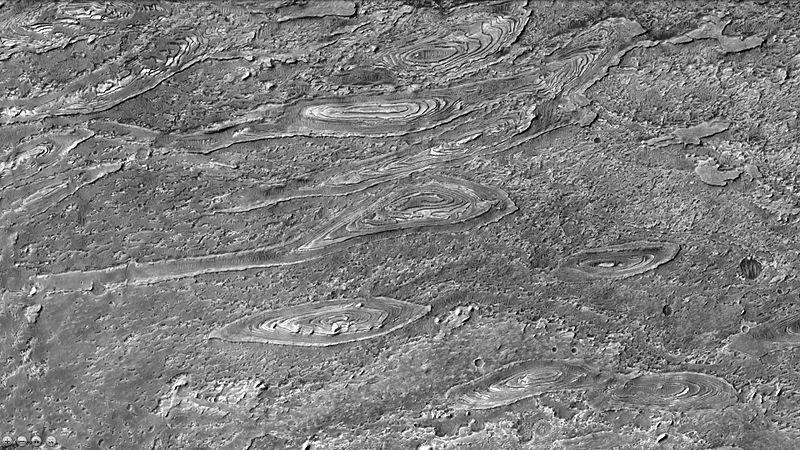 Crommelin Crater showing layers arranged in ovals as seen by ctx