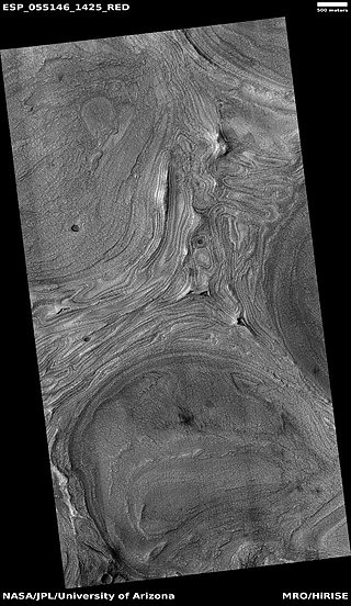 Wide view of features on floor of Hellas impact basin. The exact origin of these shapes is unknown at present.